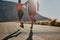 Theyre on their way. Rearview shot of two unrecognizable young people running on the road.