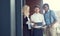 Theyre young and innovative. three young businesspeople using a tablet while standing outside on the office balcony.