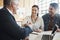 Theyve reached an agreement. a young married couple consulting with their financial advisor in his office.