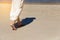 Theâ€‹ Low angle behind woman walking barefoot on beach