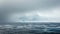 A thick blanket of fog hangs over the choppy gray waters giving the illusion of an endless expanse. In the distance the