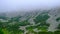 A thick cloud of fog at the foot of the High Tatras in Slovakia. The rocks are covered with mist clouds.