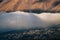 Thick cloud over Stepantsminda Kazbegi village against mountain, Georgia.