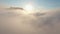 Thick clouds on background of mountain tops. Shot. Beautiful cloudy landscape with tops of high mountains on background