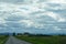 A thick cover of clouds over a highway in the Highlands of Scotland