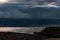 Thick dark thunderclouds above the sea