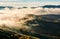 Thick fog over the rolling hill in autumn