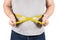 Thick mature man measuring belly yellow measuring tape isolated