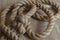 Thick natural rope randomly laid out on sackcloth