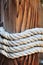 Thick rope around a wooden mooring bollard, Croatia