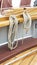Thick ropes hanging on ship hull