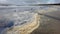 Thick sea foam on the sandy shore in County Donegal - Ireland