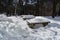 Thick snow covered outdoor table in winter season