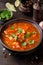 Thick tomato soup with meat, cereals and vegetables. Traditional Oriental cuisine, spicy stew with beef or lamb, rice and spices.