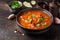 Thick tomato soup with meat, cereals and vegetables. Traditional Oriental cuisine, spicy stew with beef or lamb, rice and spices.