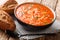 Thick vegetarian tomato soup with rice close-up in a bowl. horizontal