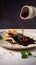 Thick velvety and delicious chocolate mole sauce on dark background, mexican food, generativ ai