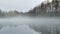 Thick white fog flies over the surface of the river, time lapse