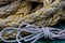 Thick Yellow Cargo Shipping Rope and Thin Boat Rope On Deck