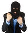 Thief in black mask in suit holding his fists