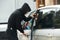 Thief burglar at automobile car stealing