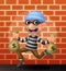 Thief carrying bag of money