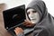 Thief hacker in mask stealing personal information from laptop