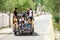 Thiksay Monastery in Thiksey village, India â€“ August 20, 2016: Smilling locals tibetan family rides by the lorry and looks in