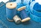 Thimble, meter and blue spools of thread