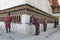 THIMPHU, BHUTAN - DEC 3, 2017: Pilgrims are spinning buddhist prayer wheels