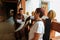 Thimphu, Bhutan - September 10, 2016: Bhutanese tourist guide demonstrating the temple to the tourist in the balcony.