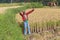 Thimphu, Bhutan - September 16, 2016: Bhutanese farmer holding a sickle in a rice field near Thimphu, Bhutan