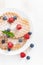 Thin Belgian waffles with berries, top view, vertical