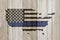 Thin blue line flag on weathered wood