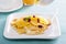 Thin crepes with citrus sauce and dried cranberry