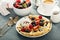 Thin crepes with whipped cream and berries