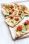 Thin crust pizza with roasted tomatoes