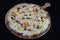 Thin crusted italian pizza with cheese and vegetables