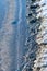 Thin ice near the shore and ice floes on the shore in the Tiligul estuary in winter, Ukraine