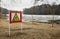 A thin ice warning sign on a city beach