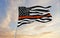 Thin Orange Line USA flag waving at sky background on sunset, panoramic view. copy space for wide banner. SAR First Responders,