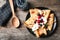 Thin pancakes with berries and cream on plate