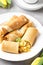 Thin pancakes (crepes) with apple filling, stuffed rolls, Russian traditional food for maslenitsa, French dessert, breakfast with