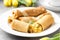 Thin pancakes (crepes) with apple filling, stuffed rolls, Russian traditional food for maslenitsa, French dessert, breakfast with