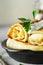 Thin pancakes with fillings. tasty stuffed pancakes crepes with cabbage closeup. Russian Fried Stuffed Pancakes Blintzes with