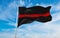 Thin Red Line flag waving at cloudy sky background on sunset, panoramic view. Firefighters, Fire Service Personnel flag. copy