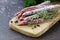 Thin salami sausage snack with herbs