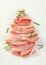 Thin slices of ham with rosemary