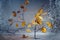 Thin twigs with golden orange autumn leaves standing partially behind a frosted glass plate against a gray blue background,