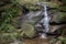 Thin waterfall at a trail located on Tijuca Forest, Rio de Janeiro